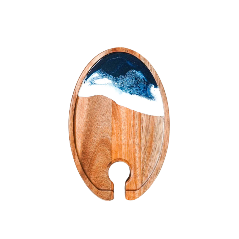 Wooden coaster with blue and white design on a white background