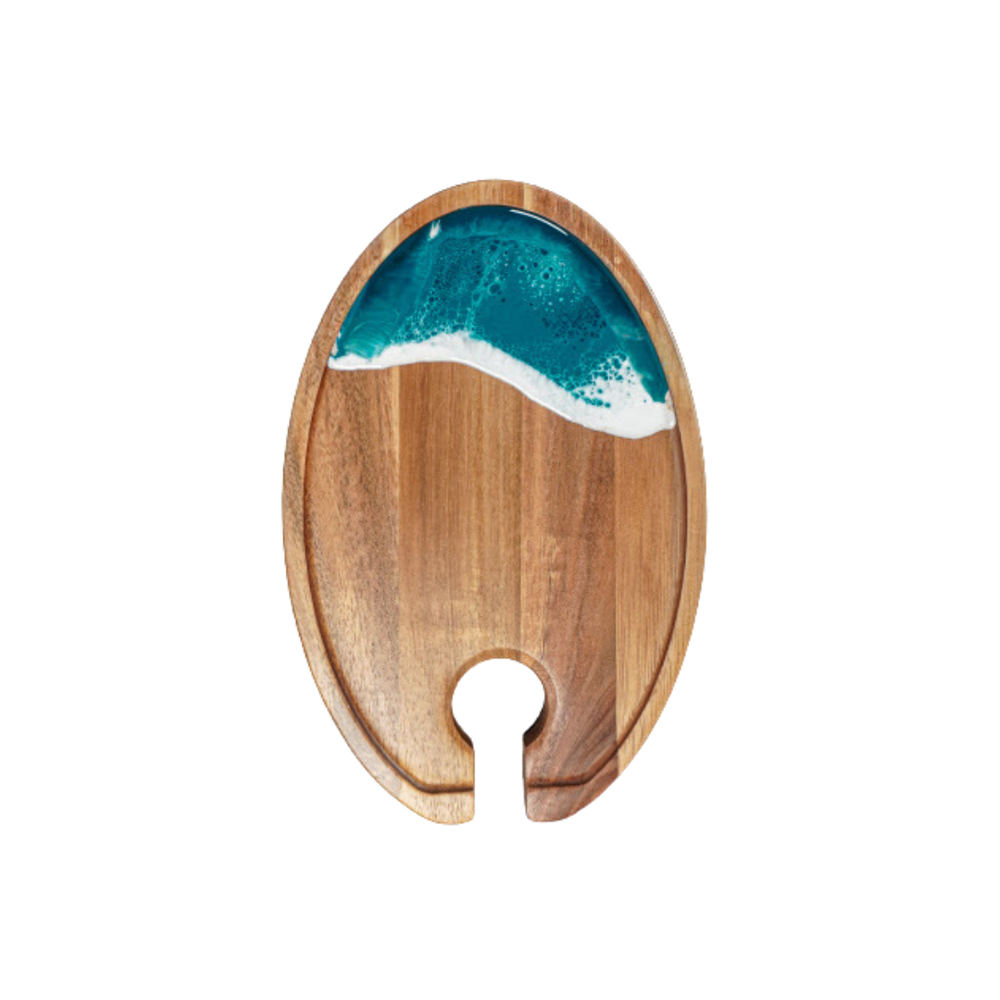 Wooden coaster with a resin ocean wave design on a white background