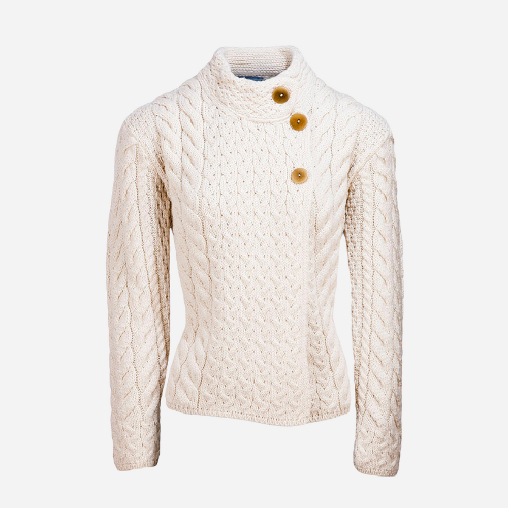 Cream-colored cable knit cardigan with button details on a white background