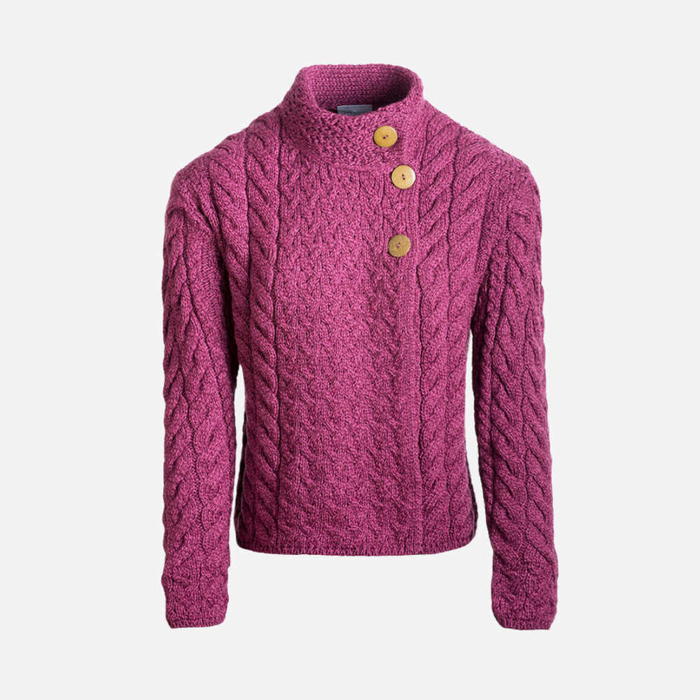 Pink knitted sweater with button details on a white background