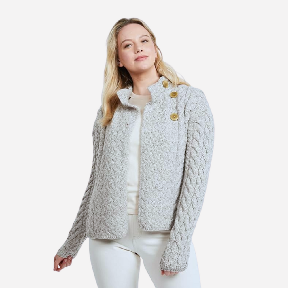 Woman wearing a textured gray jacket on a white background