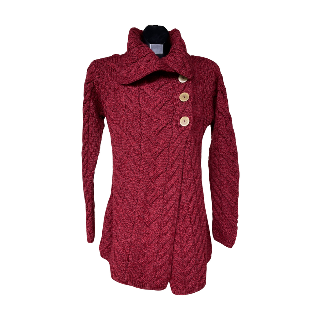 A red cable knit cardigan with contrast stitching and three buttons on the front.