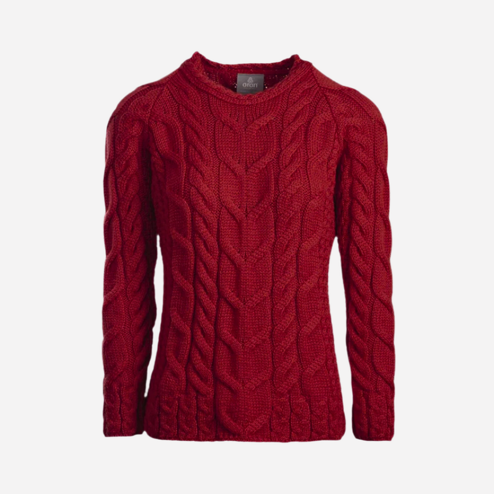Red cable knit sweater on a white background