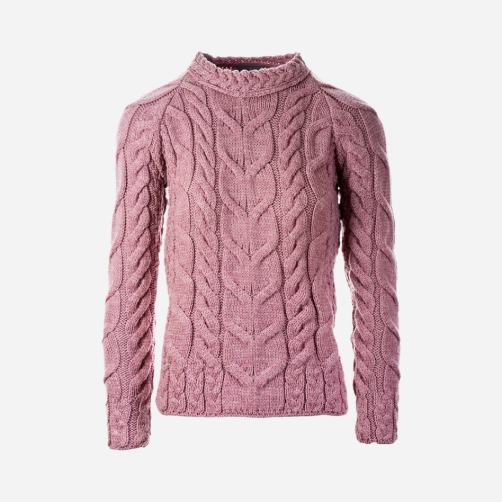 Pink cable knit sweater on a white background