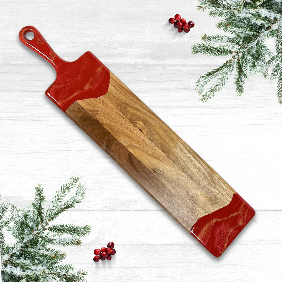 This baguette board made of Acacia wood and crafted with natural eco-friendly red/gold epoxy