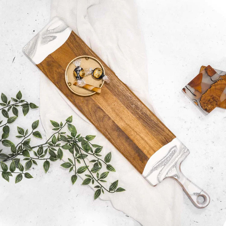 This baguette board made of Acacia wood and crafted with natural eco-friendly white/silver epoxy