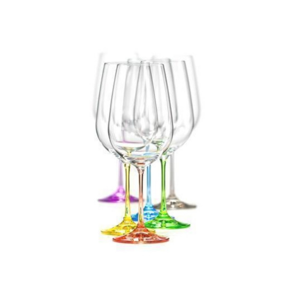 A set of Bohemia Rainbow wine glasses with clear upper parts and multicolored stems, arranged in a row.