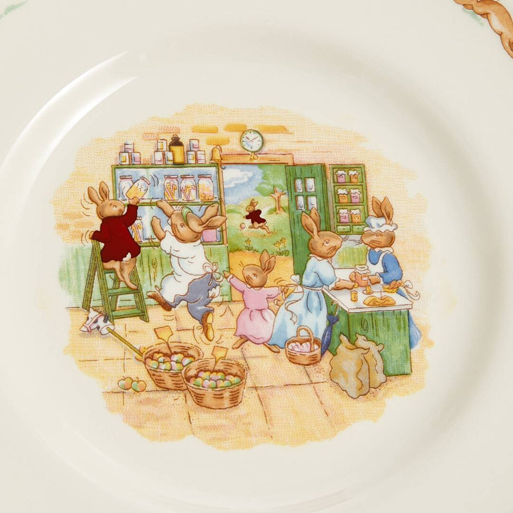Illustration of bunnies in a kitchen on a ceramic plate