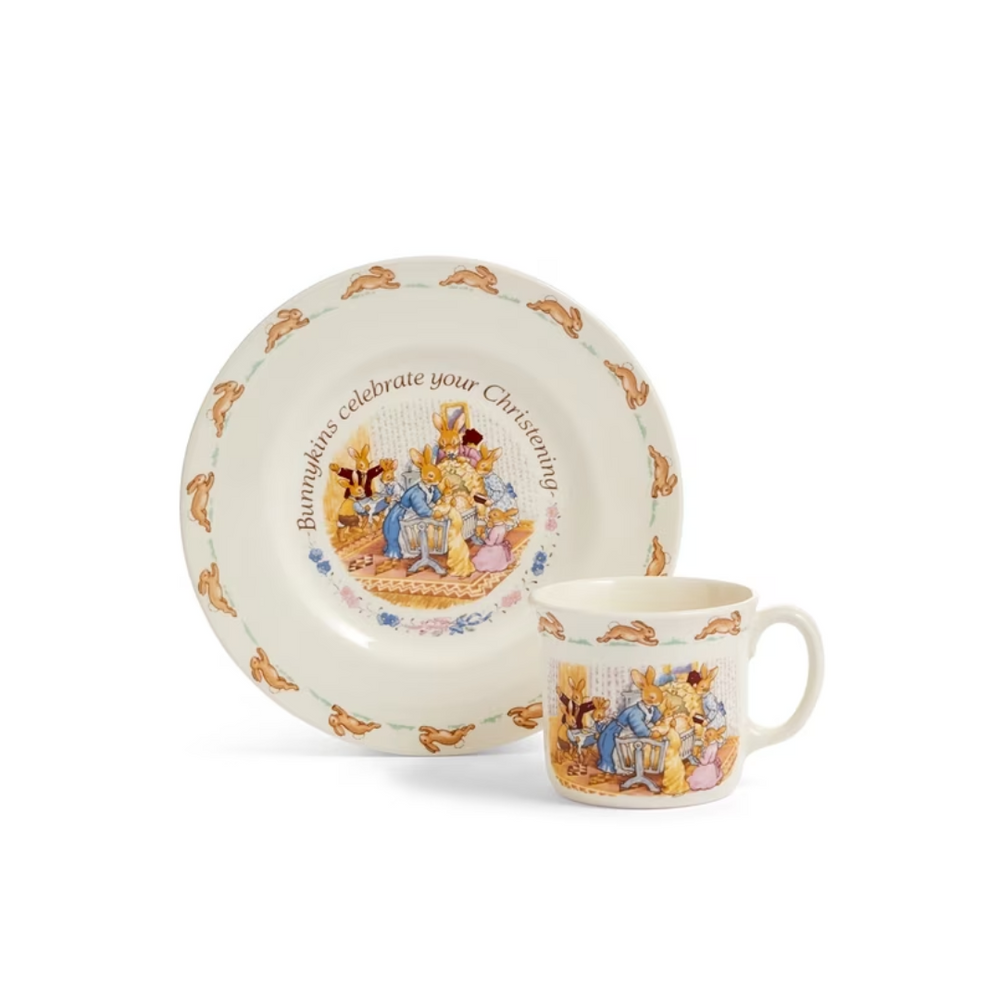 A white ceramic Christening plate and mug set with Bunnykins design, presented against a plain background.
