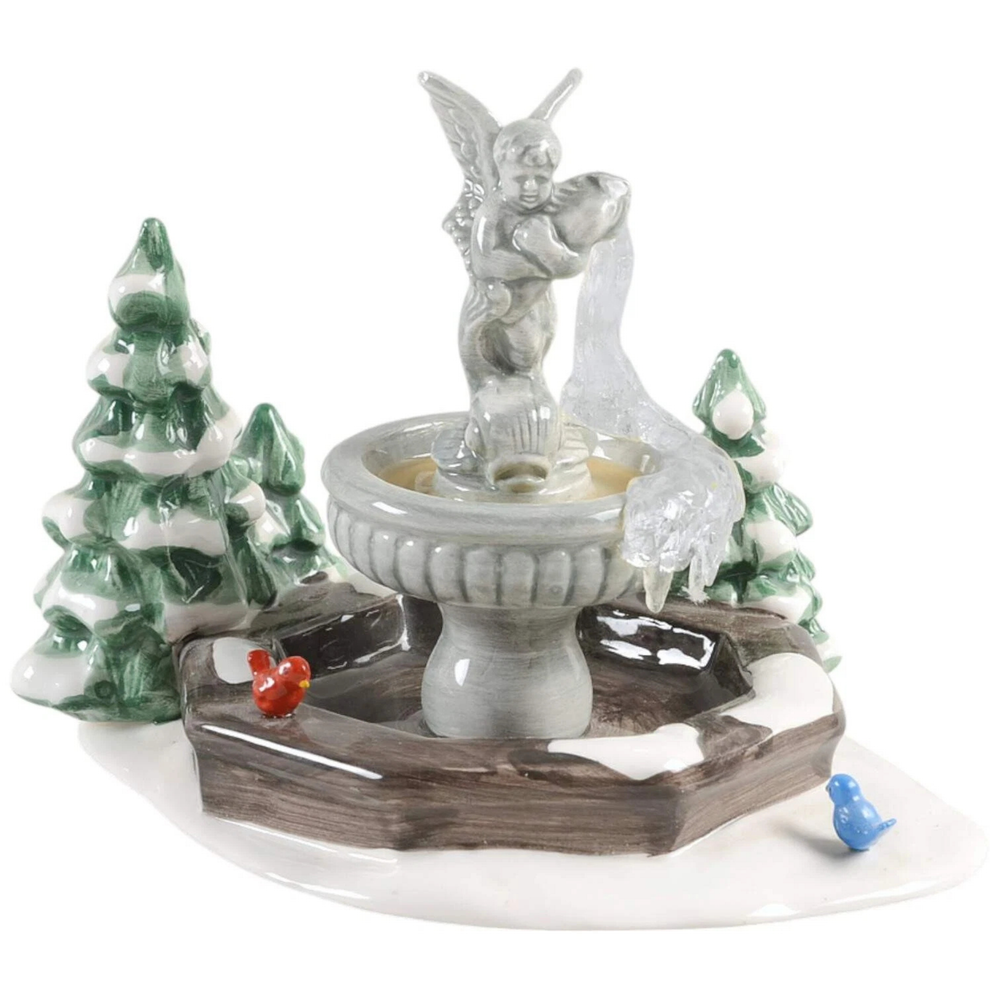 Grey Statue of an Angel on top of a water fountain, with two evergreen trees behind against a white background.