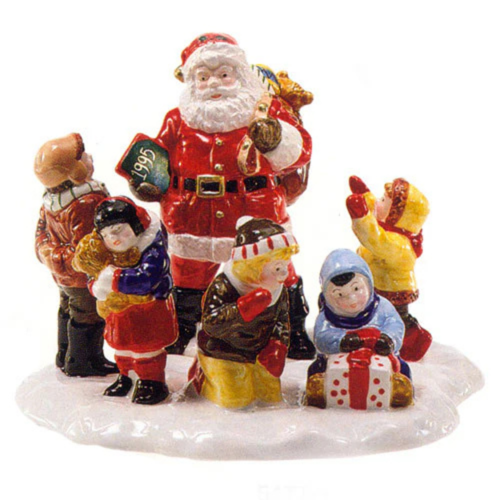 Decorative figurine of Santa Claus with children on a white background