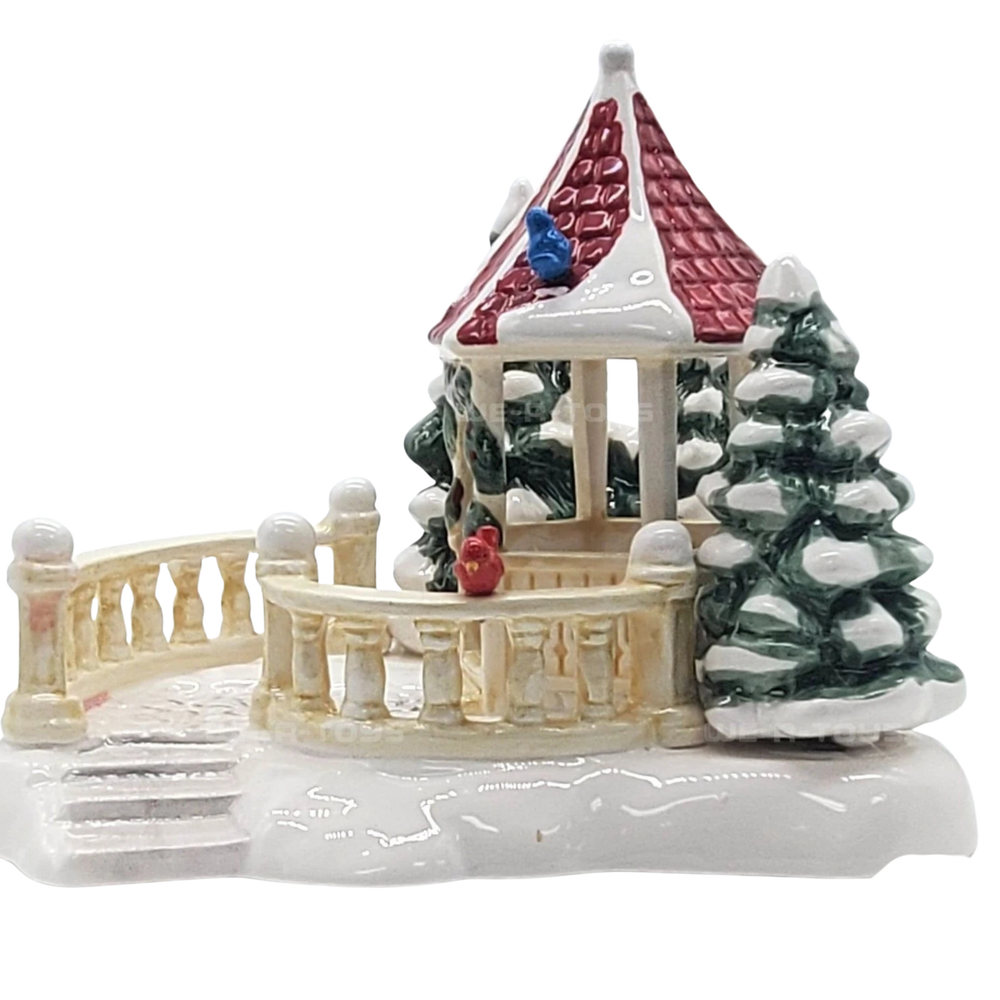 Decorative winter scene with a gazebo, trees, and a bridge on a white background