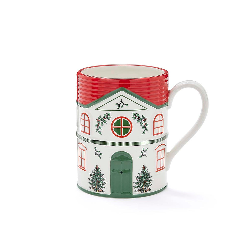 Festive mug shaped like a house with red roof, green door, and Christmas tree designs. Holistic holiday decor with a cheerful, cozy vibe.