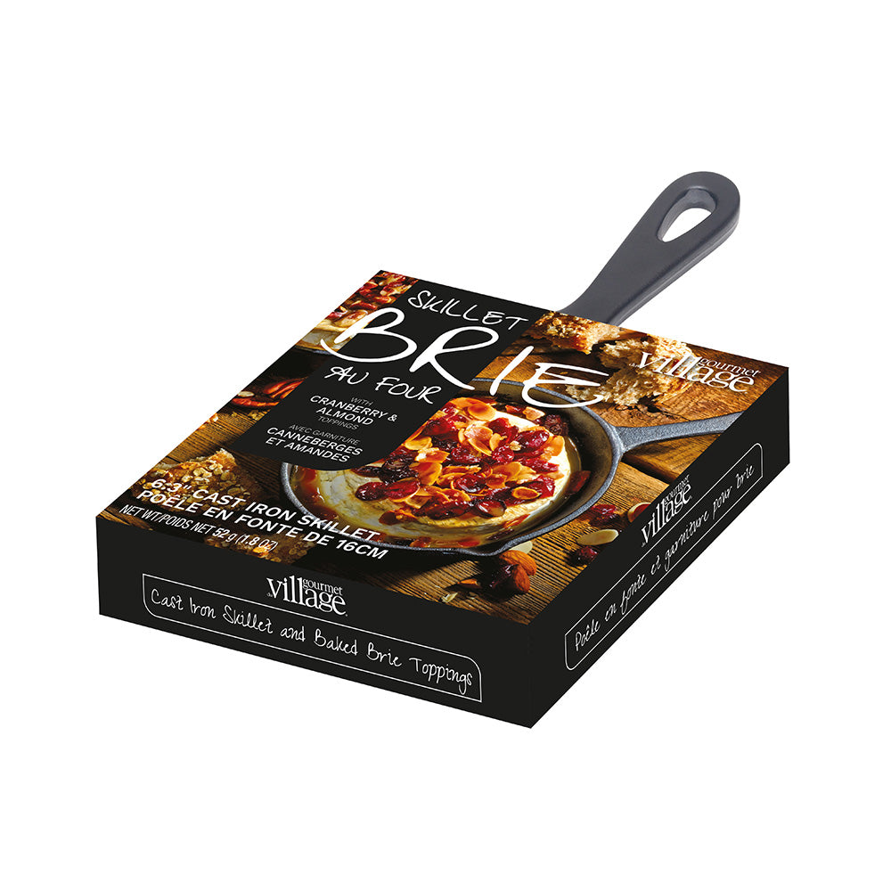 Village brand 9u Four Sizzlet Brie Du Four cast iron skillet and baked brie topping set, shown in its retail packaging box on a white background.