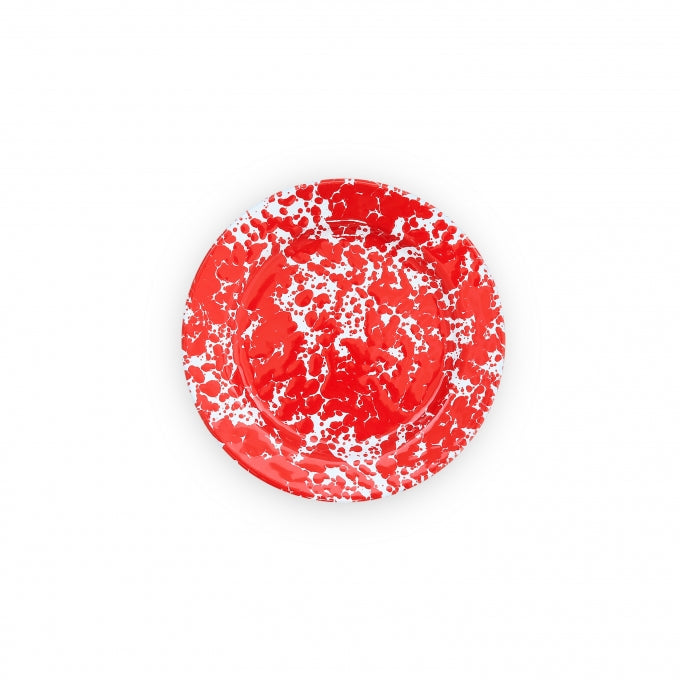 A red enamel Crow Canyon salad plate with a white speckled pattern