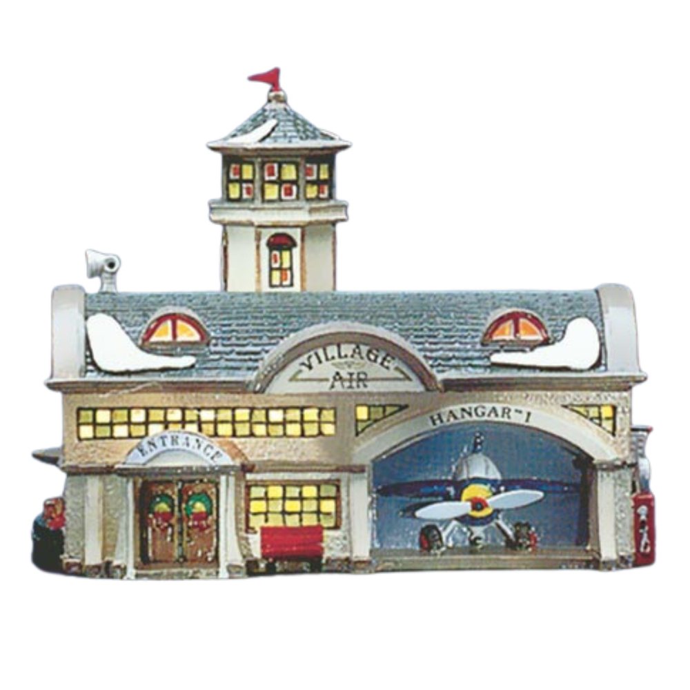 Model of a vintage airplane hangar with 'Village Air' branding on a white background