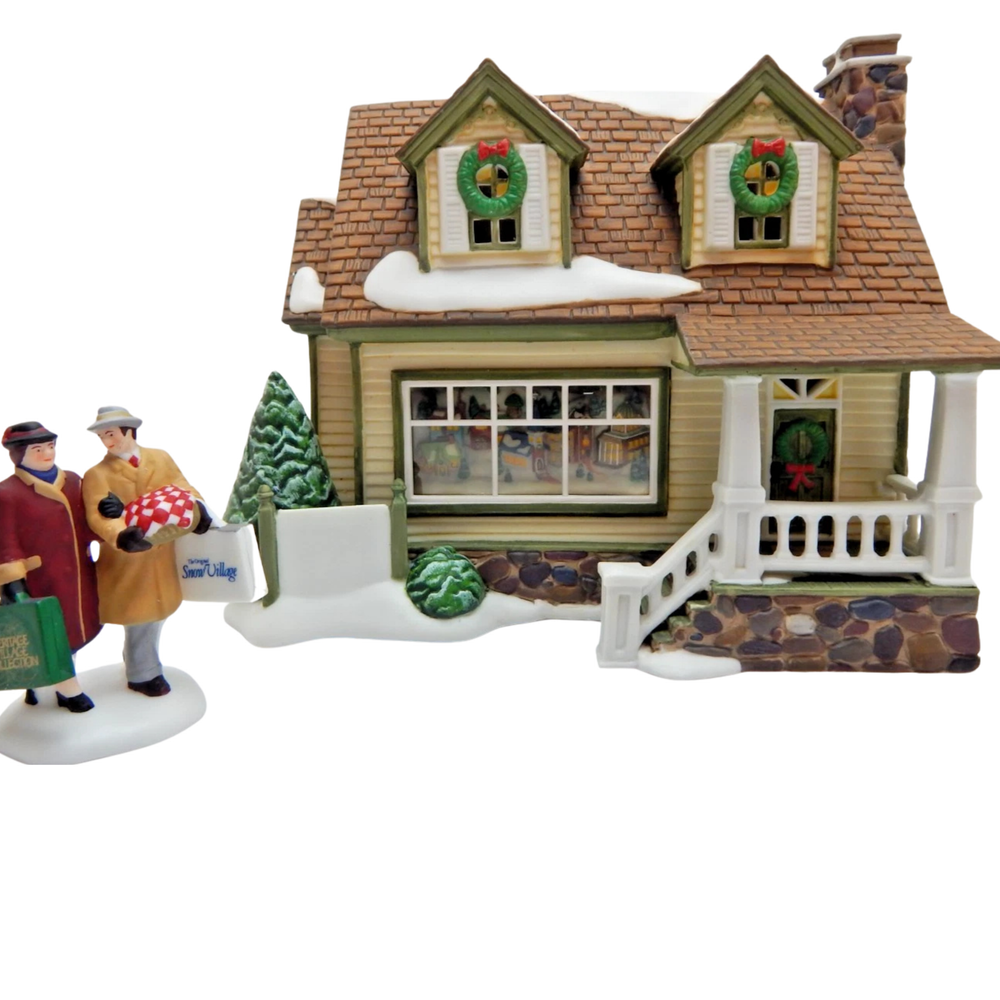 A decorative house with two figures walking in the front, against a white background.