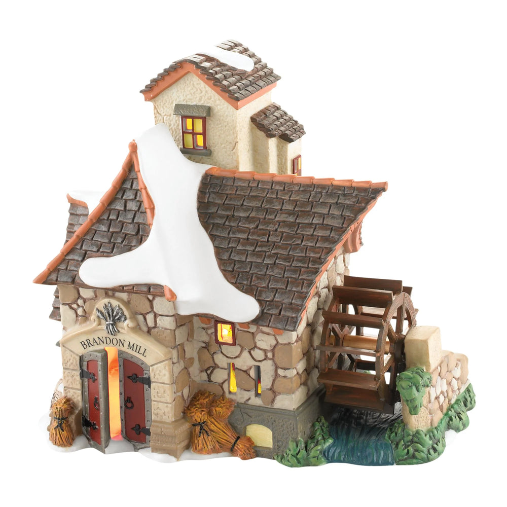 A porcelain Dickens' Village Series mill building, with a thatched roof and a water wheel, illuminated from within.