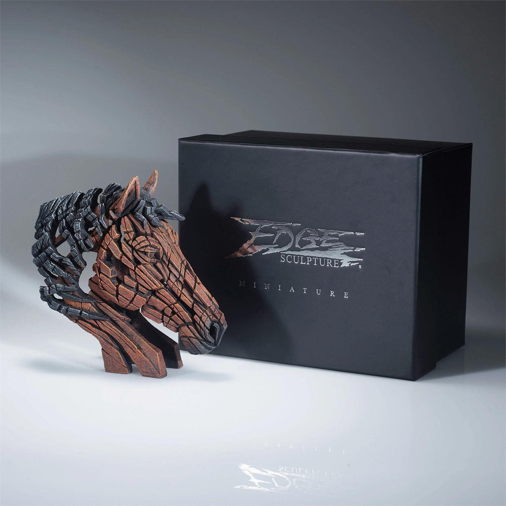 A miniature horse bust sculpture next to its black packaging box, with the Edge Sculpture logo.