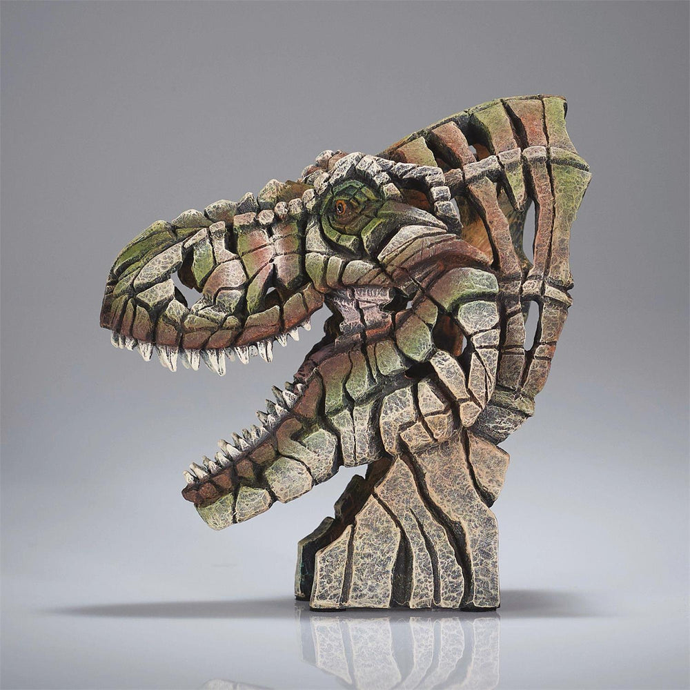 Dinosaur-like creature sculpture with a camouflage pattern on a gray background
