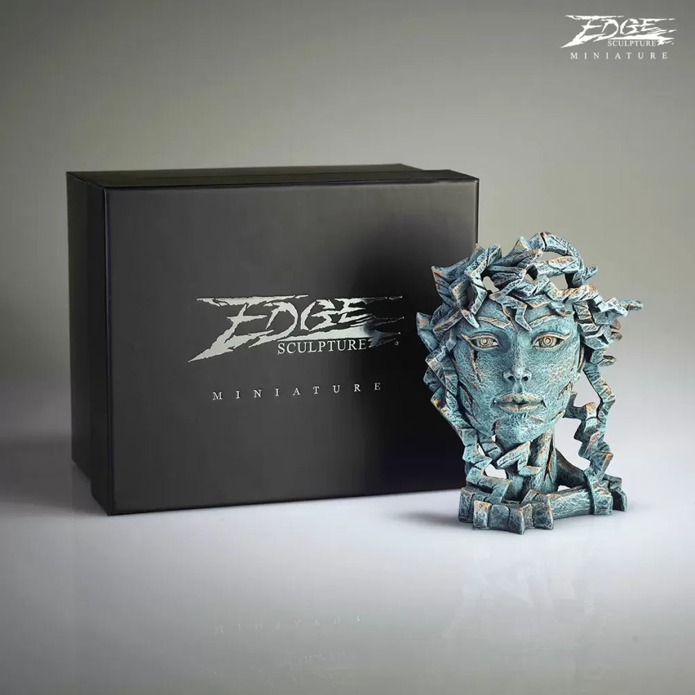 A miniature sculpture of a Venus bust alongside its black packaging box with the 'Edge Sculptures' brand visible.