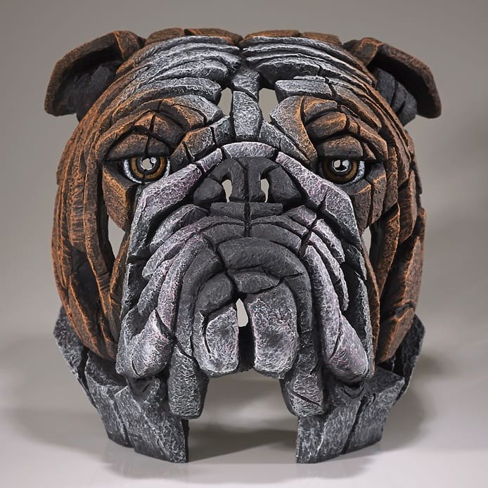 A sculpture of a bulldog's head with a black and brown color palette, designed by Matt Buckley and made by Edge Sculpture.
