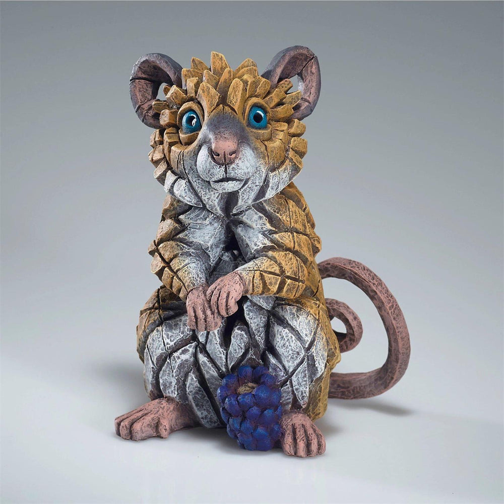 Fantasy creature figurine with detailed design on a gray background