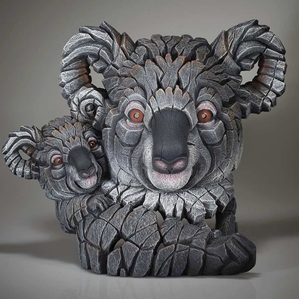 A sculpture of a koala and its joey with a contemporary design, predominantly in gray tones.