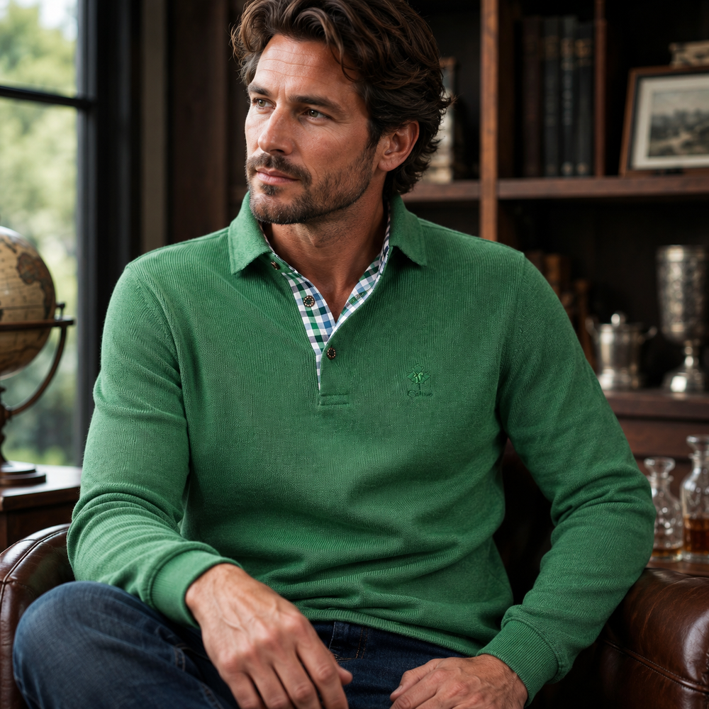 Men’s green quarter-zip sweater with check-lined collar, styled in a refined study with leather seating, bookshelves, and warm natural light.