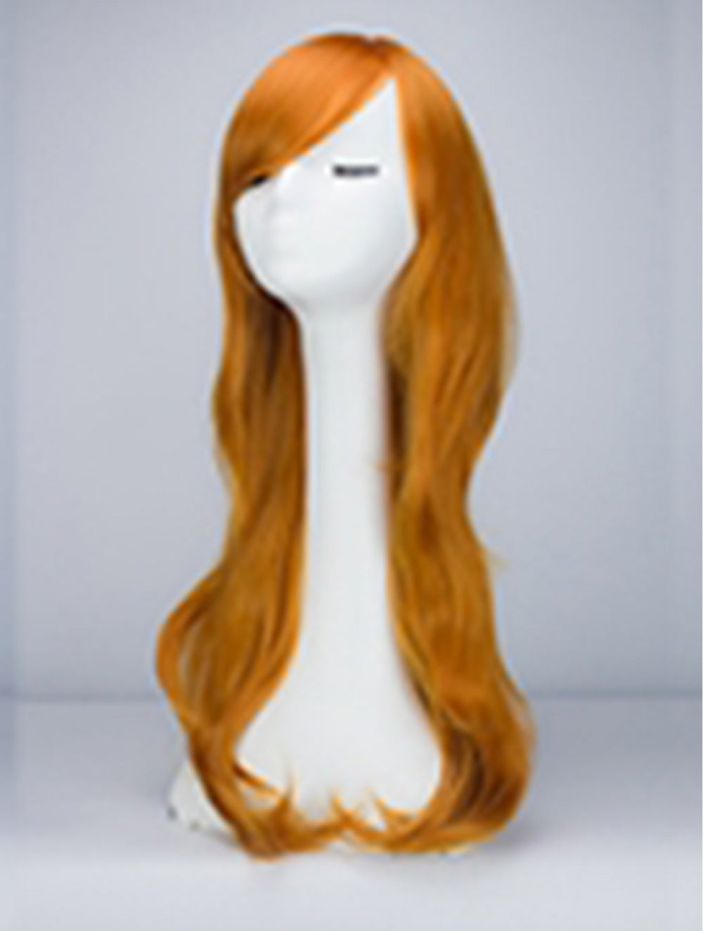 A long, wavy orange wig displayed on a white mannequin head against a light gray studio background.