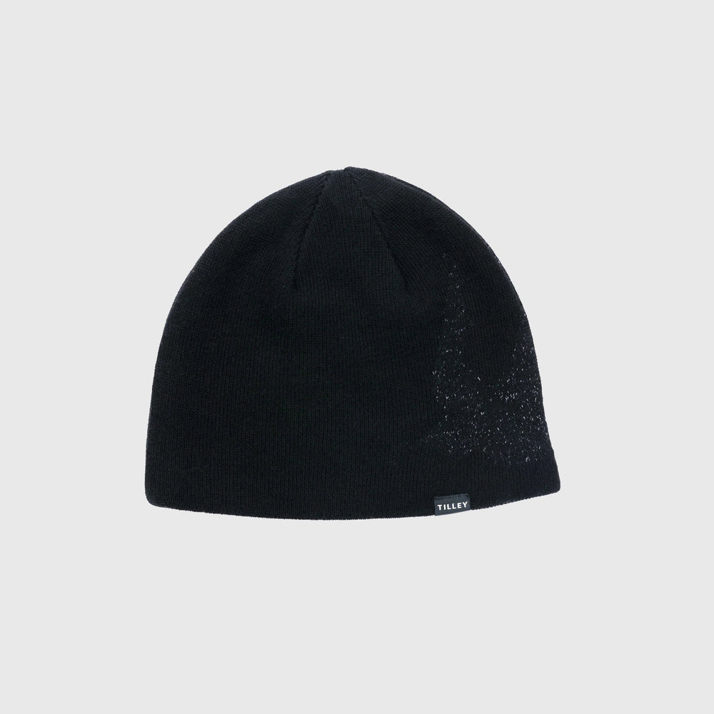 A black knit beanie hat with a subtle textured pattern on the right side and a small white 'TRUCK' logo on the brim, shown against a light gray background.