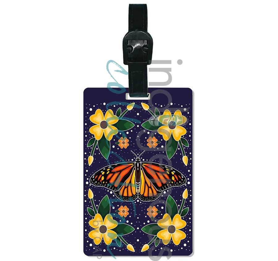 Luggage tag with a butterfly and floral design on a dark background