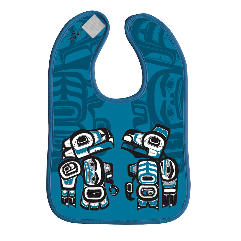 Blue bib with artistic designs on a white background