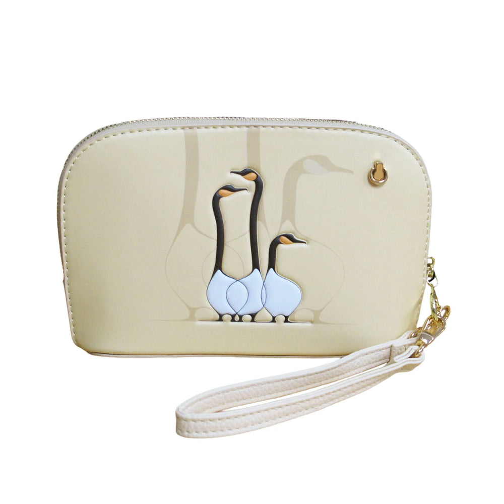 Beige wristlet with penguin design on a white background