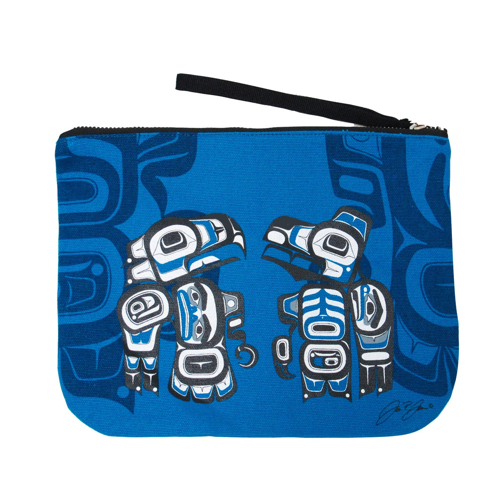 Blue pouch with tribal designs on a white background