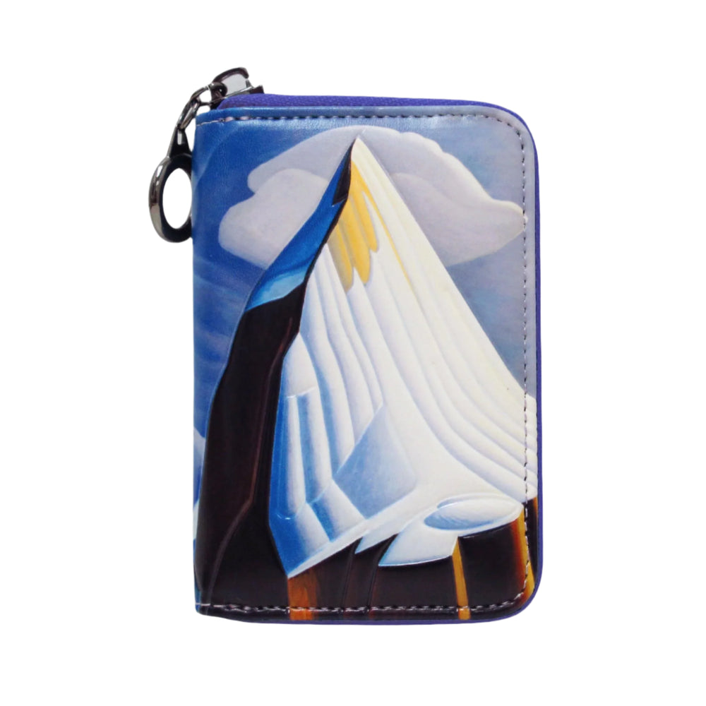 Keychain with sailboat design on a white background