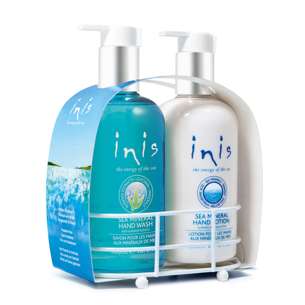 Two bottles of 'inis' hand wash and lotion on a white background