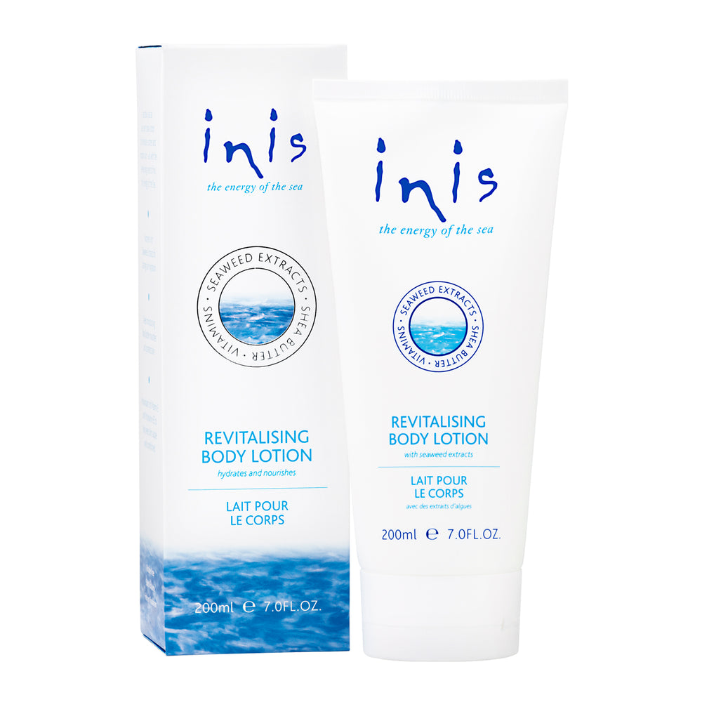 Two bottles of 'inis' revitalising body lotion on a white background