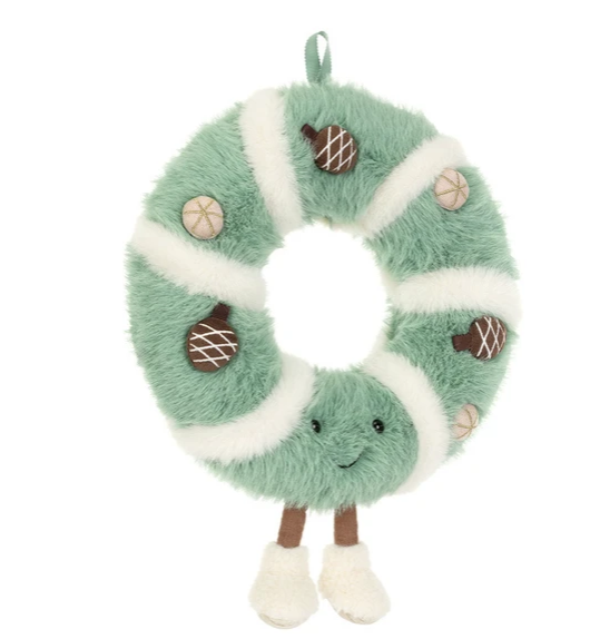 A plush green and white striped wreath-shaped ornament with a smiling face, small acorn decorations, and dangling legs, shown on a plain white background.