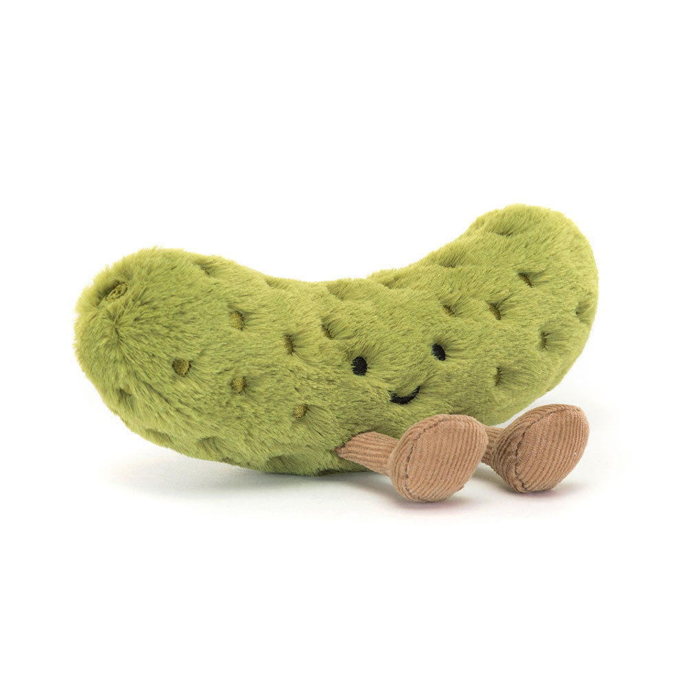 A plush toy designed to look like a green pickle with embroidered freckles and nutty cord boots.