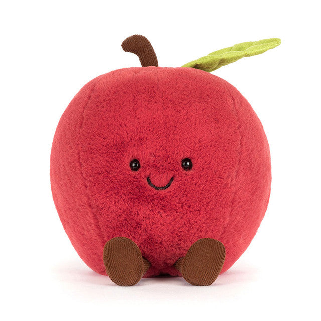 Plush toy apple with a smiling face on a white background