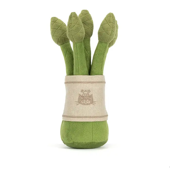 Set of green 
asparagus in a beige holder on a white background