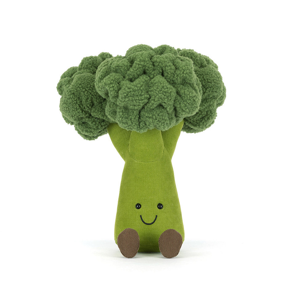Toy broccoli with a smiling face on a white background