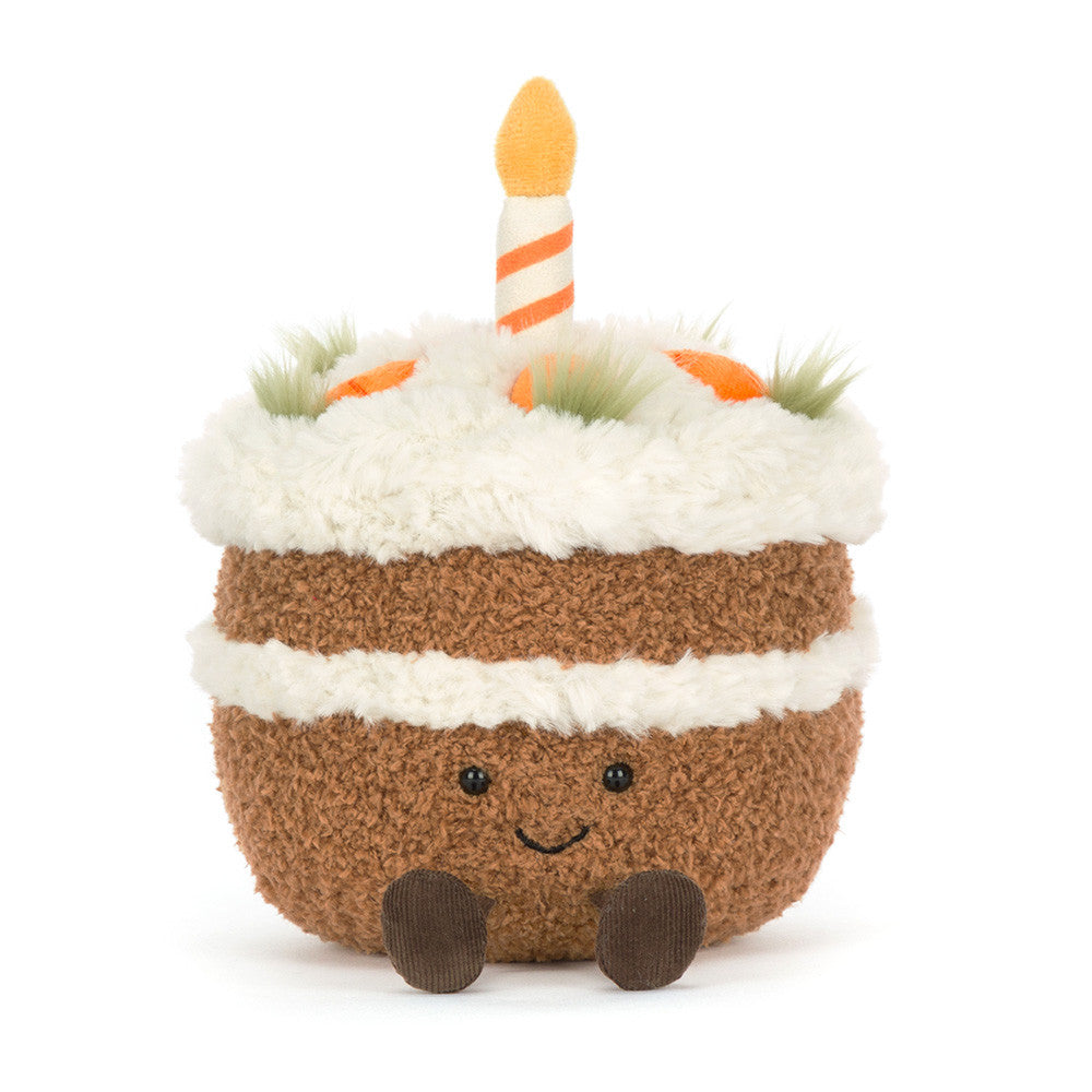 Toy cake with candles on a white background