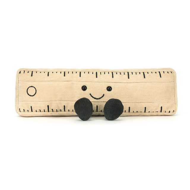 Toy ruler with a smiley face on a white background