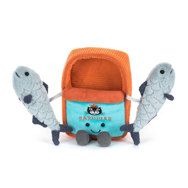 Toy with a blue container and orange lid, resembling sardines, with two gray fish-shaped toys on a white background.