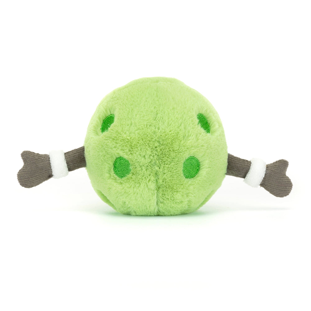 Green plush toy with brown arms and white accents on a white background