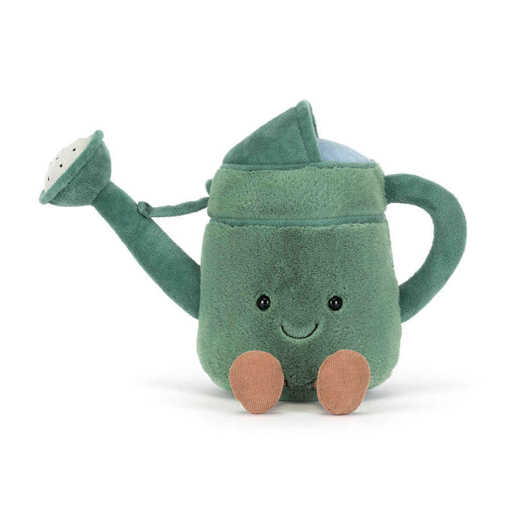 Plush toy watermelon with a smiling face on a white background