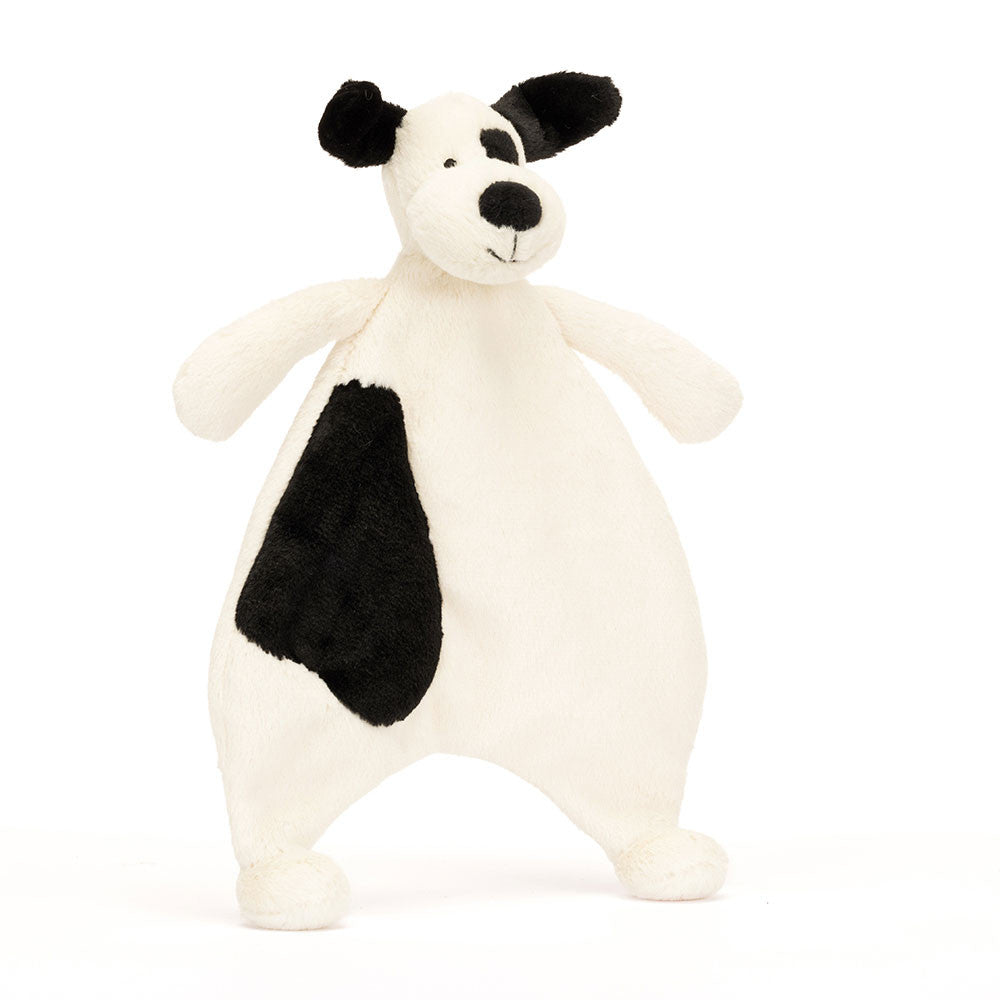 A plush toy depicting a Bashful Black & Cream Puppy Comforter with a cream-colored body, black patches, and a stuffed nose.