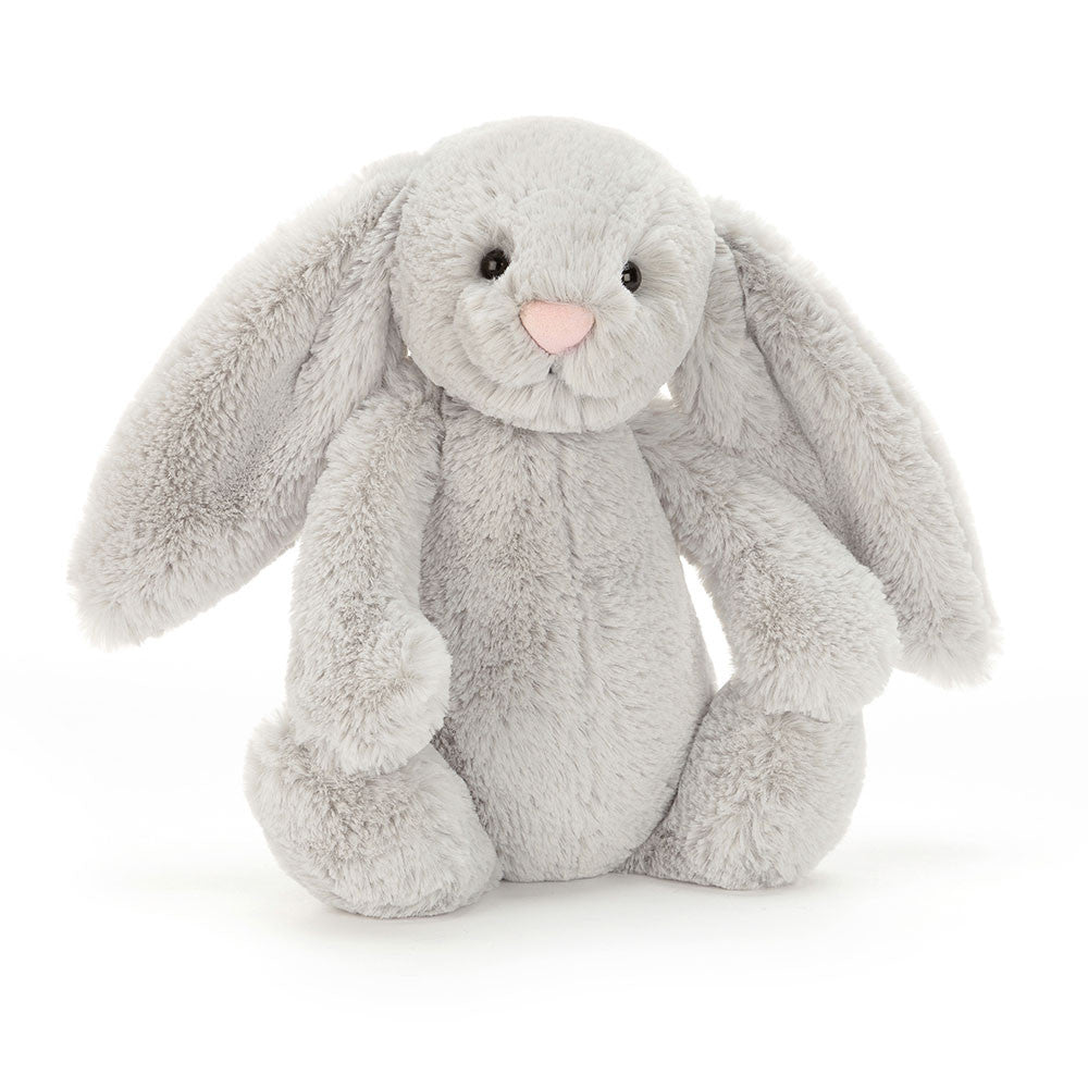 A plush toy  bunny with long ears, sitting upright.